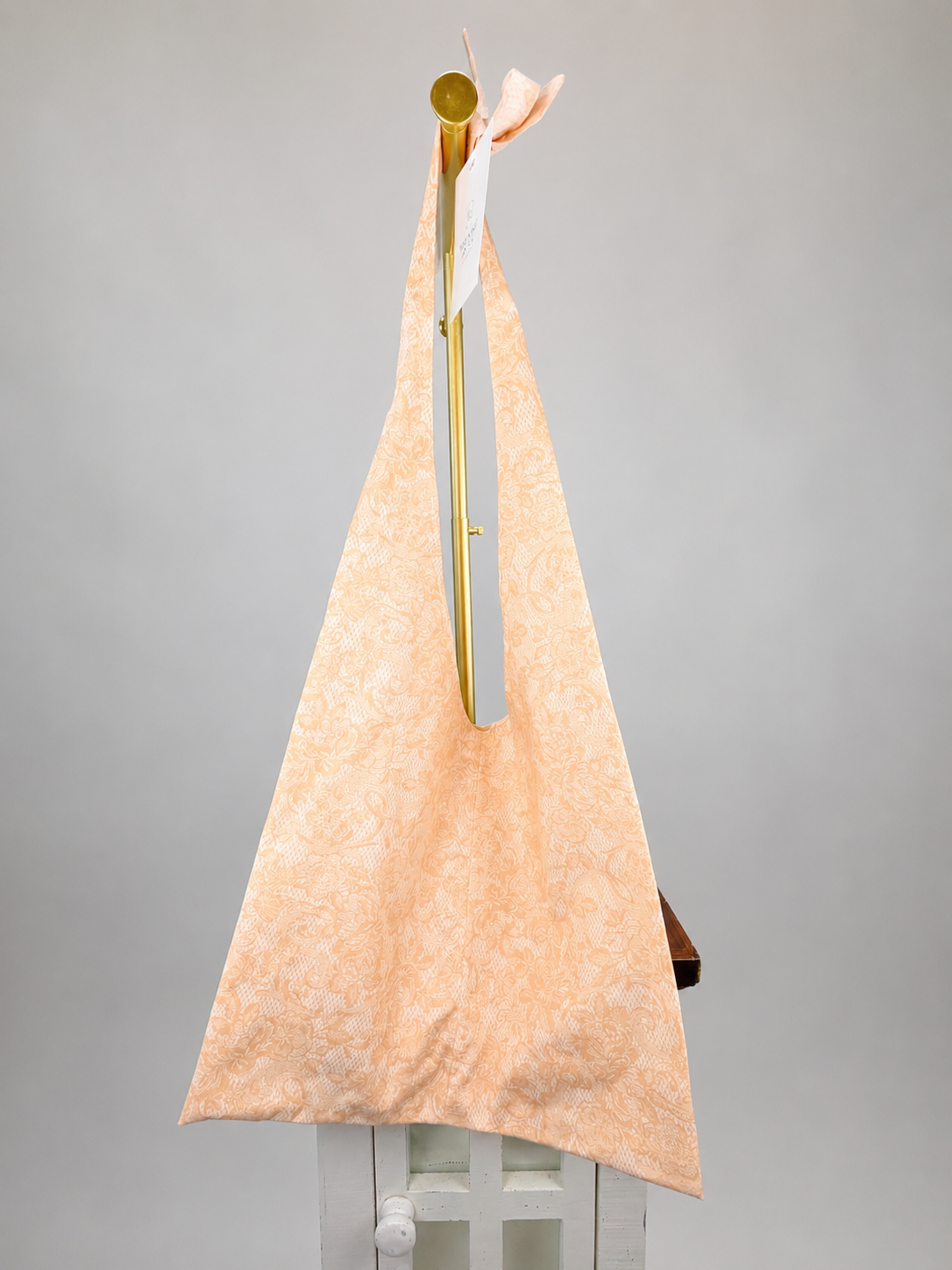 Brooke & Co slouchy bag peach floral with bow on strap front view