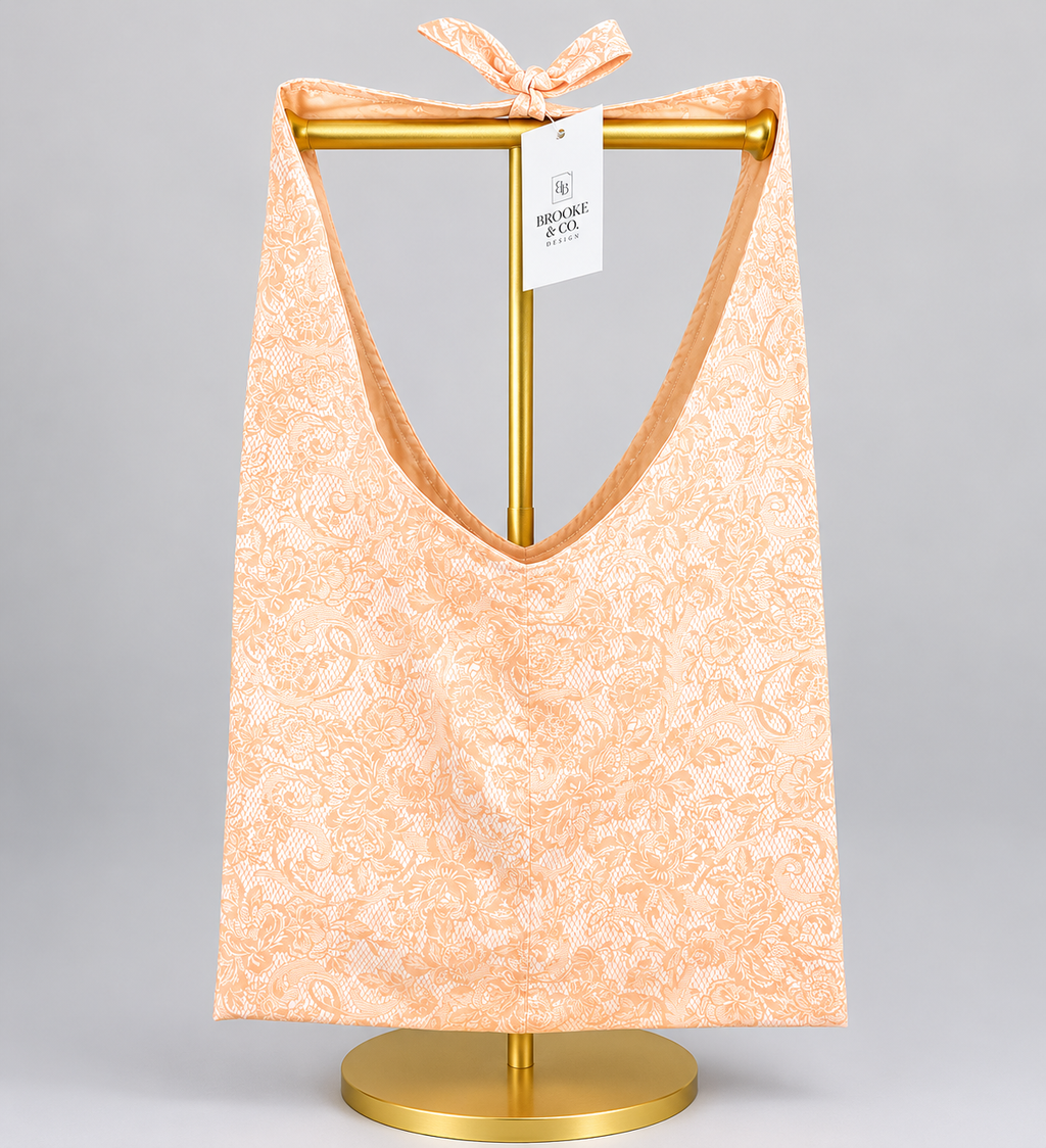 Brooke & Co slouchy bag peach floral with bow on strap front 