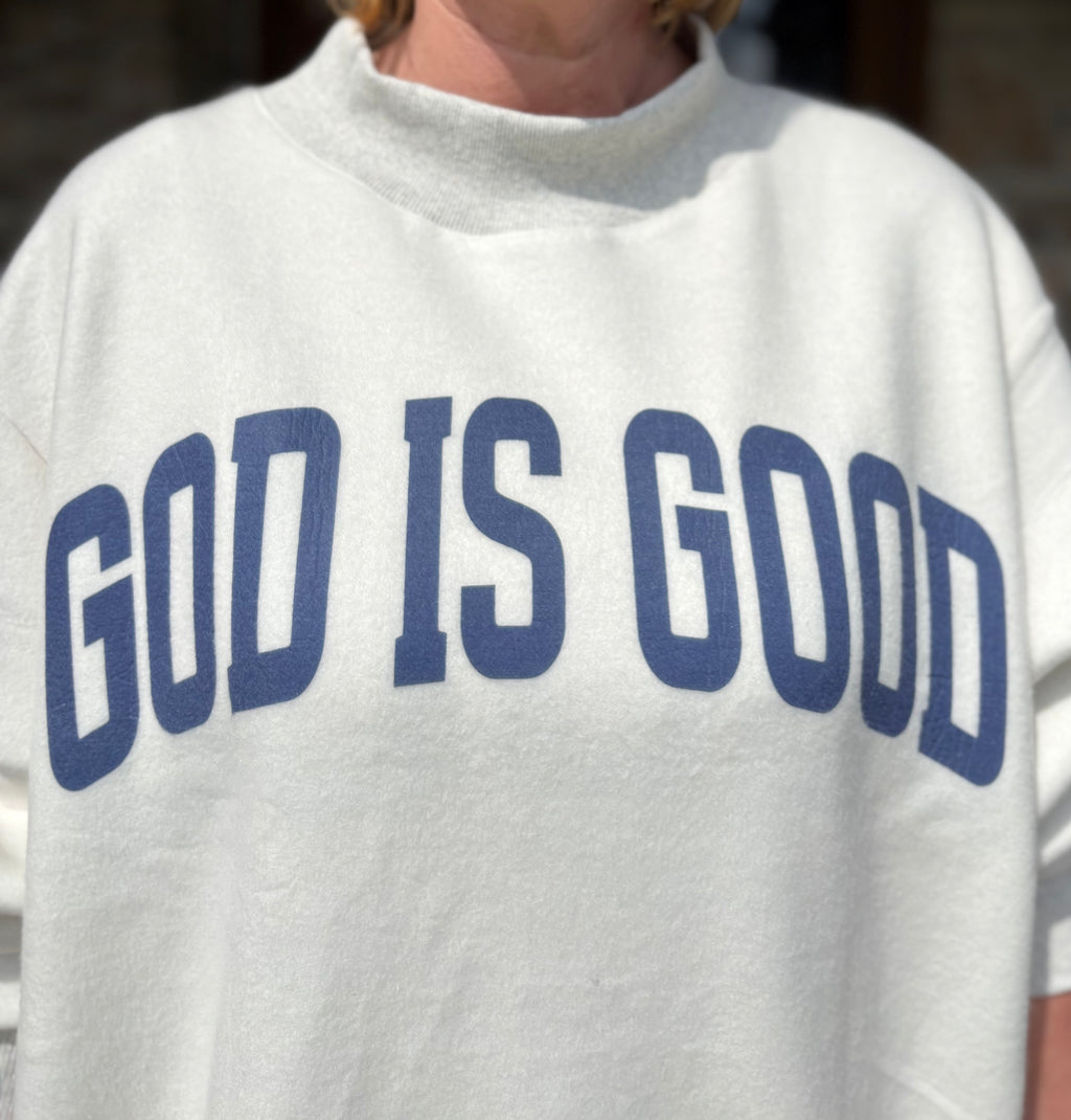 Brooke & Co God is Good/Jesus Mock Neck Sweatshirt, white & ash grey oversized sweatshirt with blue God is Good graphic up close view