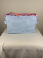 Brooke & Co ruffle beauty bag with ruffle trip detail and zipper