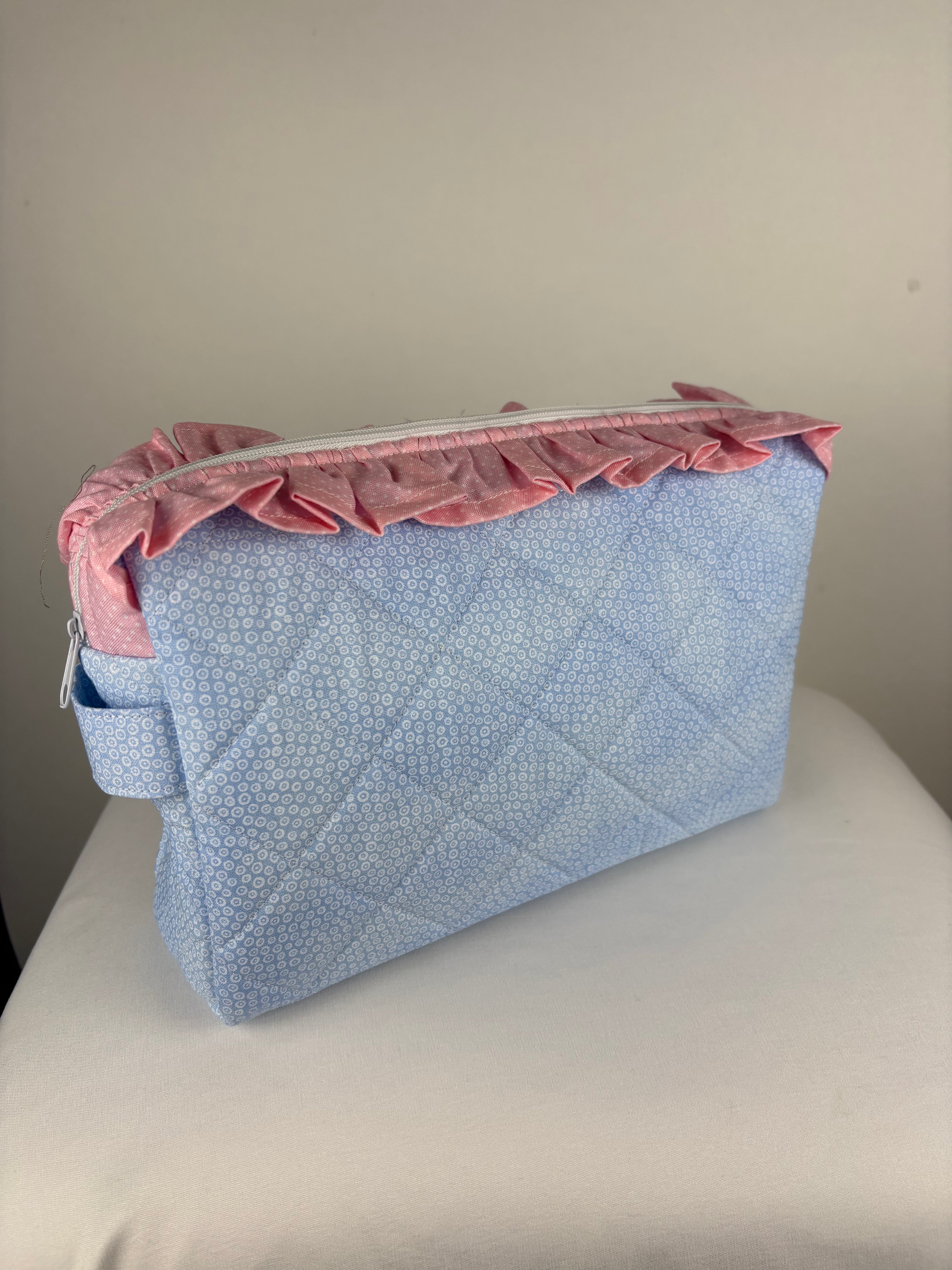 Brooke & Co ruffle beauty bag with ruffle trip detail and zipper