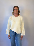 brooke & co the lillian sweater is a cream oversized fit with a subtle cable knit detailing along the sleeves and sides, drop shoulders, and an easy silhouette