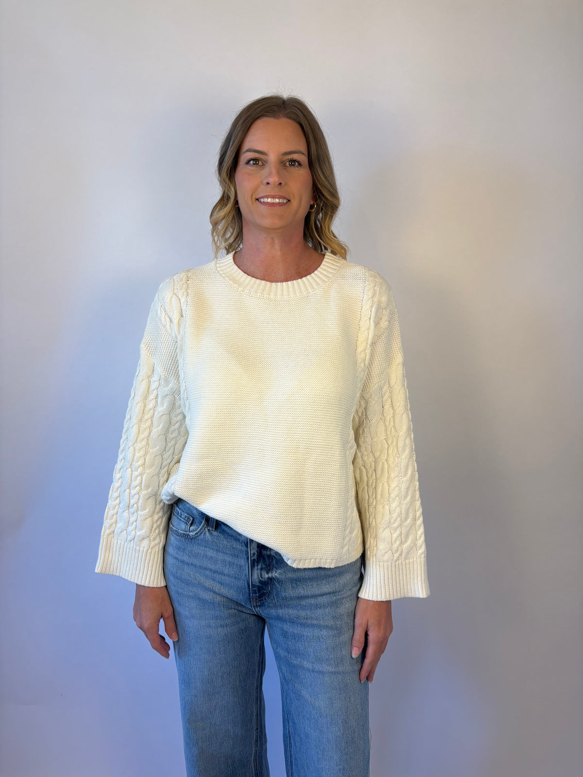 brooke & co the lillian sweater is a cream oversized fit with a subtle cable knit detailing along the sleeves and sides, drop shoulders, and an easy silhouette