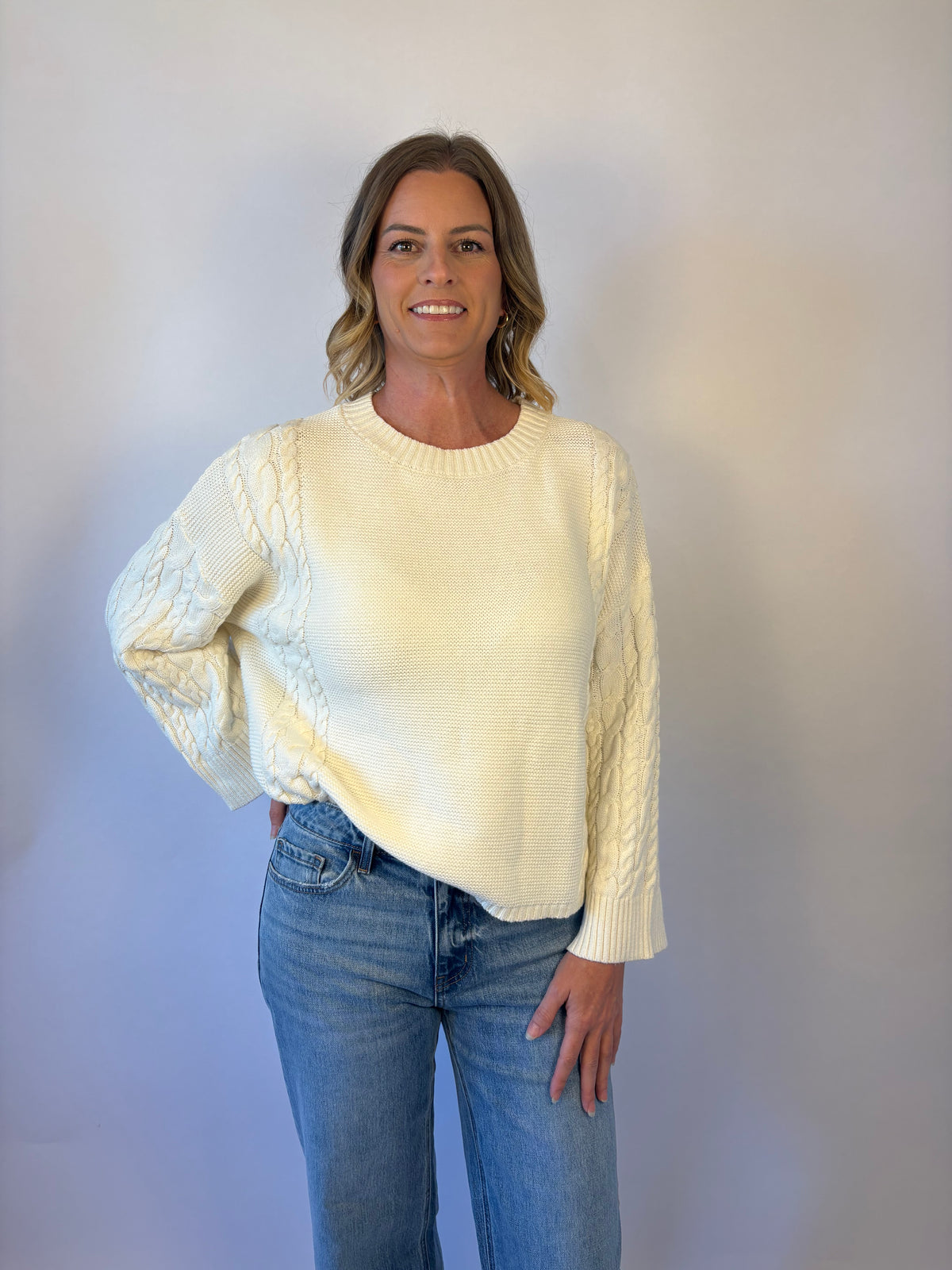 brooke & co the lillian sweater is a cream oversized fit with a subtle cable knit detailing along the sleeves and sides, drop shoulders, and an easy silhouette