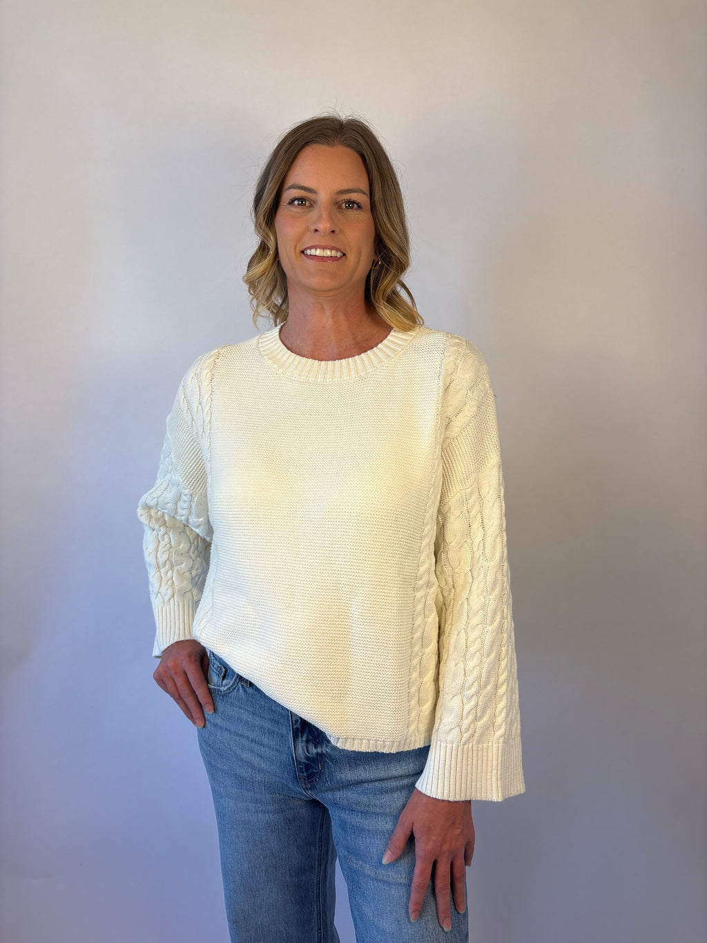 brooke & co the lillian sweater is a cream oversized fit with a subtle cable knit detailing along the sleeves and sides, drop shoulders, and an easy silhouette
