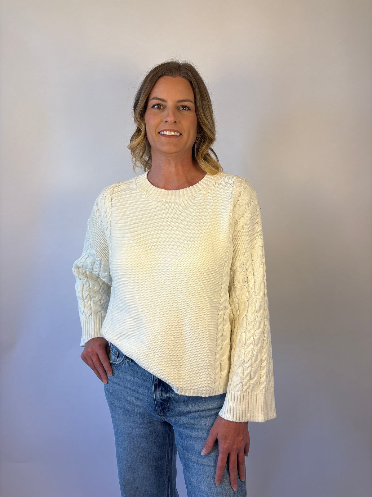 brooke & co the lillian sweater is a cream oversized fit with a subtle cable knit detailing along the sleeves and sides, drop shoulders, and an easy silhouette