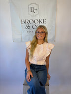 Brooke & co petal blouse with red and white stripe with white flower embroidery and ruffle detail