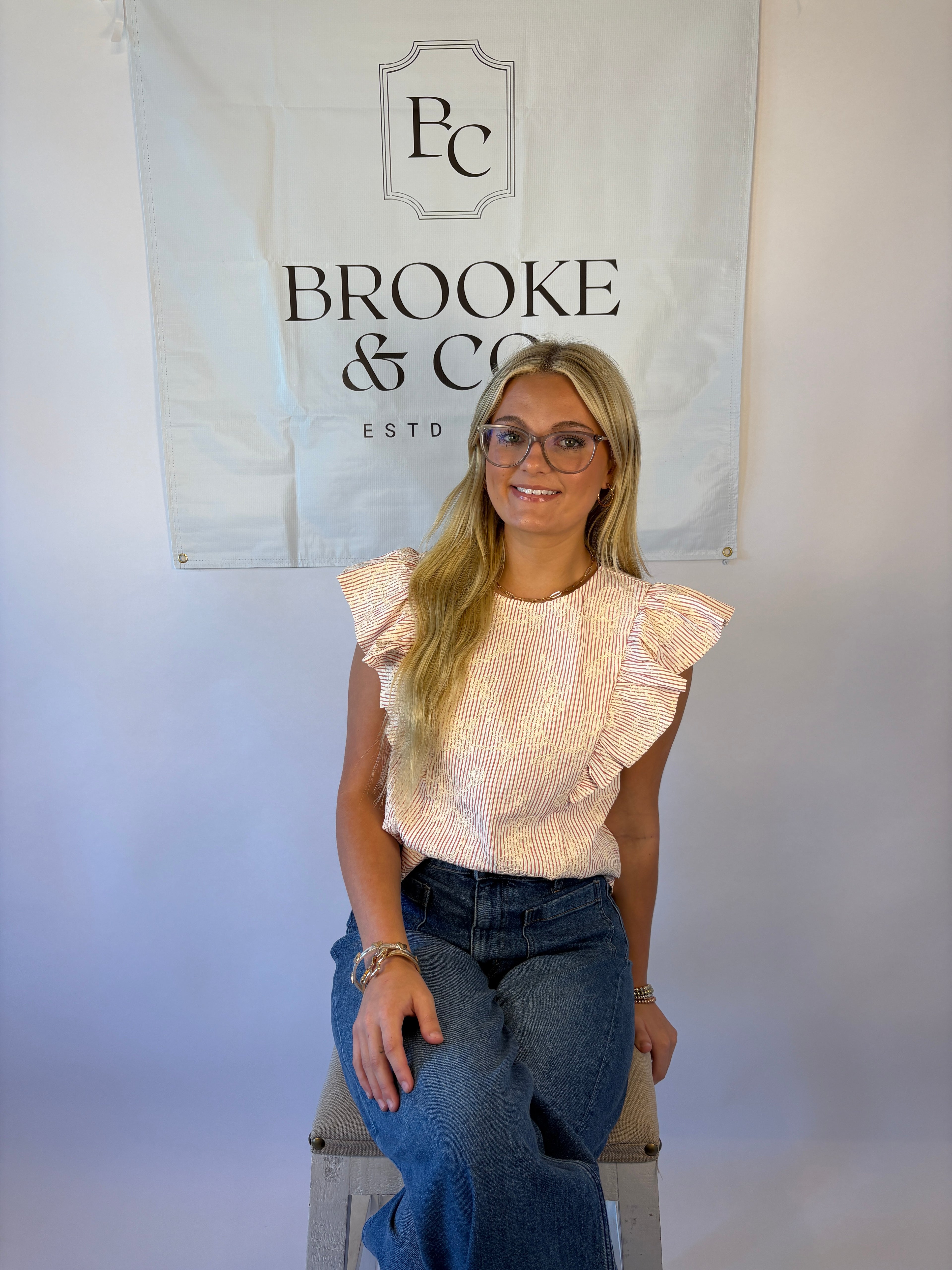 Brooke & co petal blouse with red and white stripe with white flower embroidery and ruffle detail