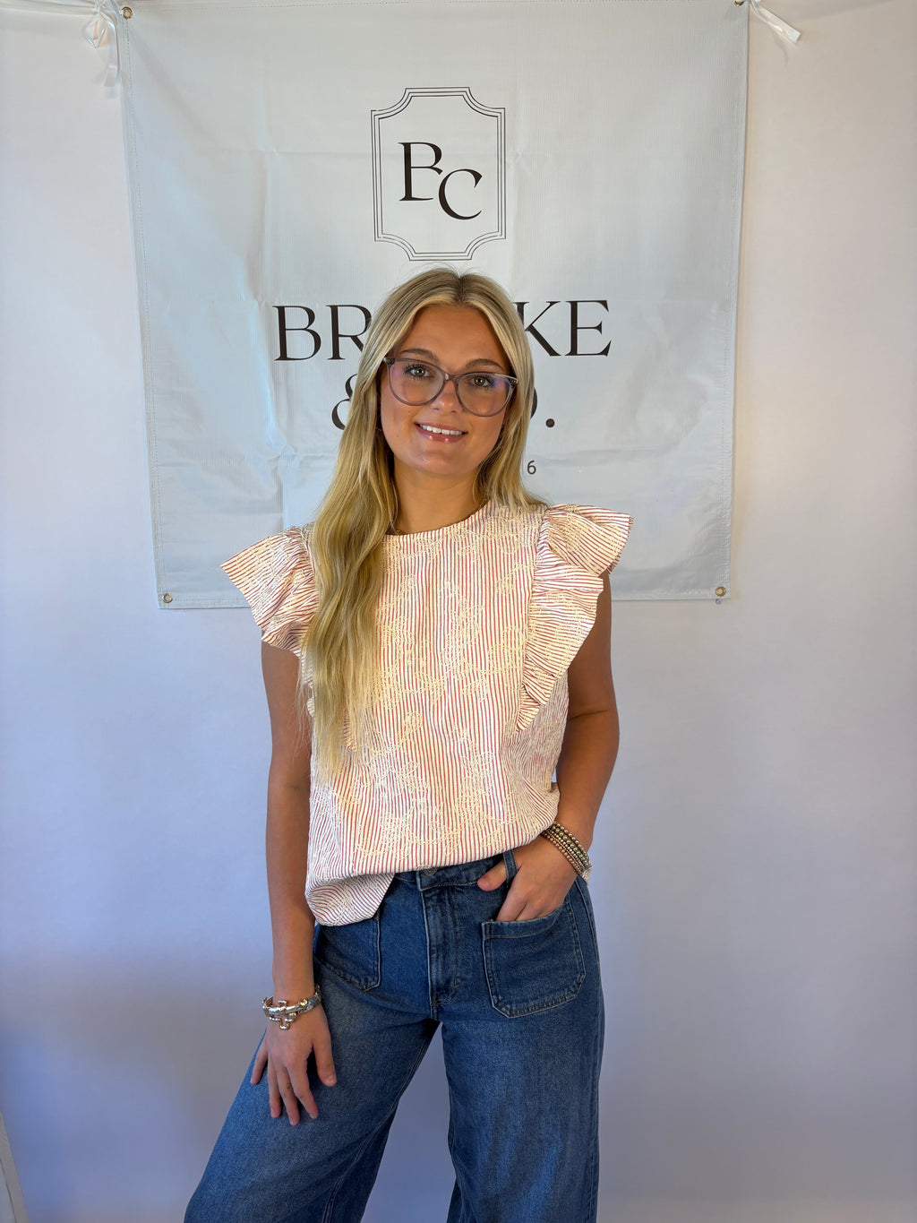 Brooke & co petal blouse with red and white stripe with white flower embroidery and ruffle detail