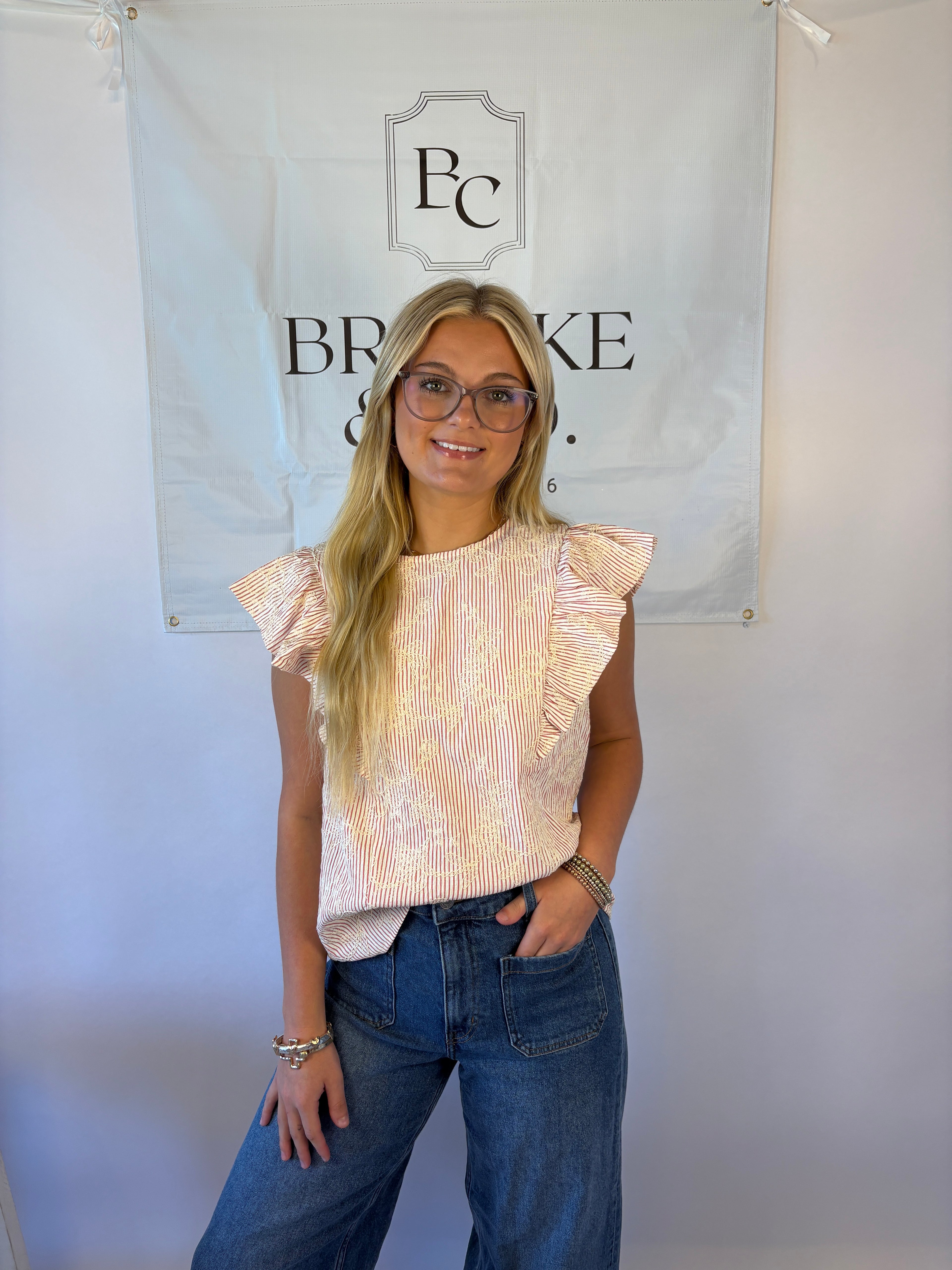 Brooke & co petal blouse with red and white stripe with white flower embroidery and ruffle detail
