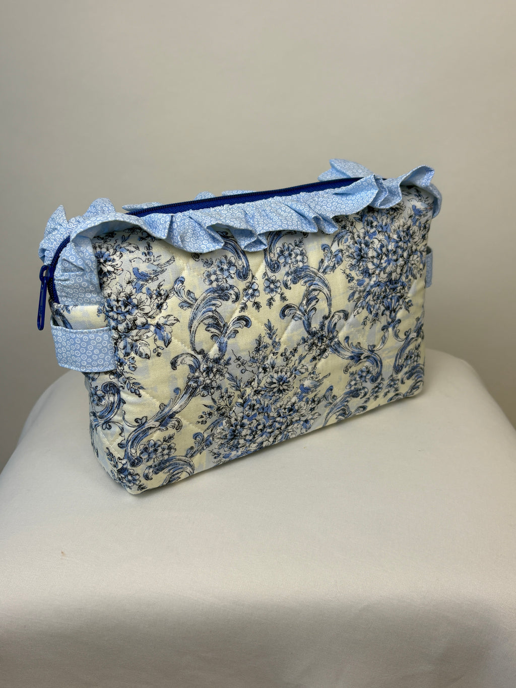 Brooke & Co ruffle beauty bag with ruffle trip detail and zipper