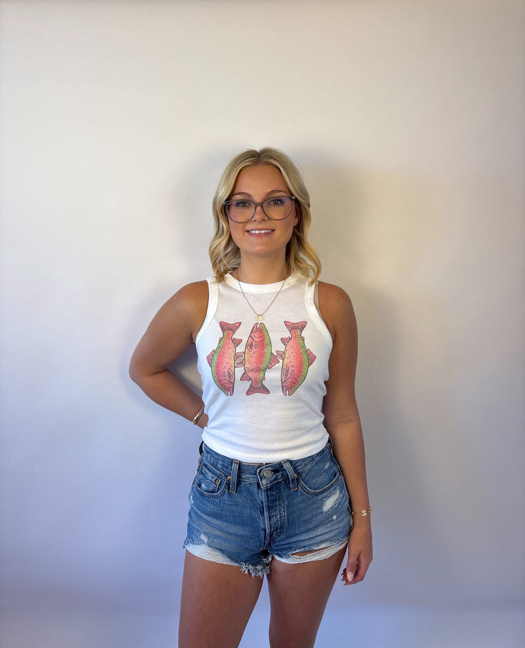 Brooke & Co Rosie reel tank featuring a sleeveless white tank with 2 pink trout fish