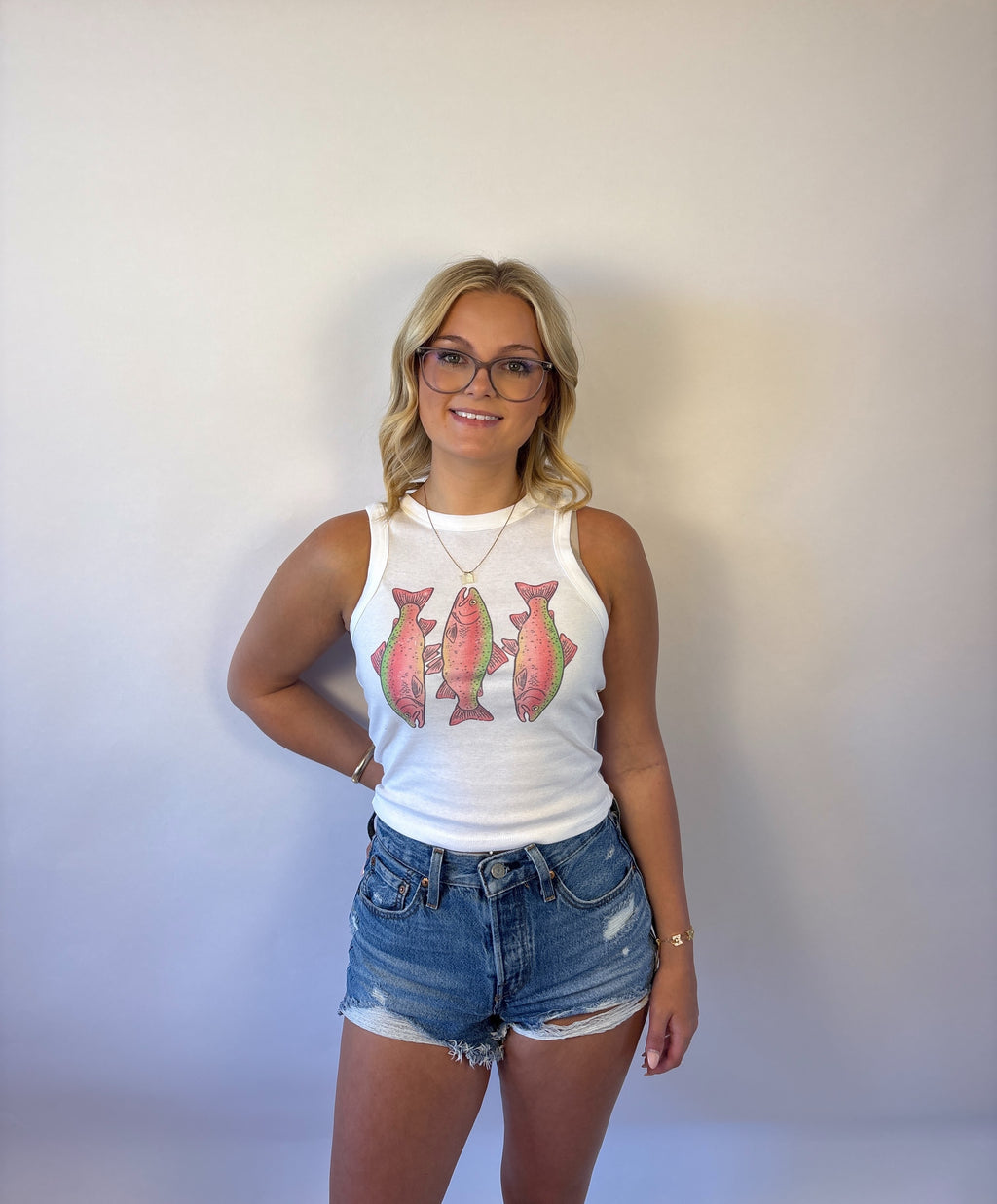 Brooke & Co Rosie reel tank featuring a sleeveless white tank with 2 pink trout fish