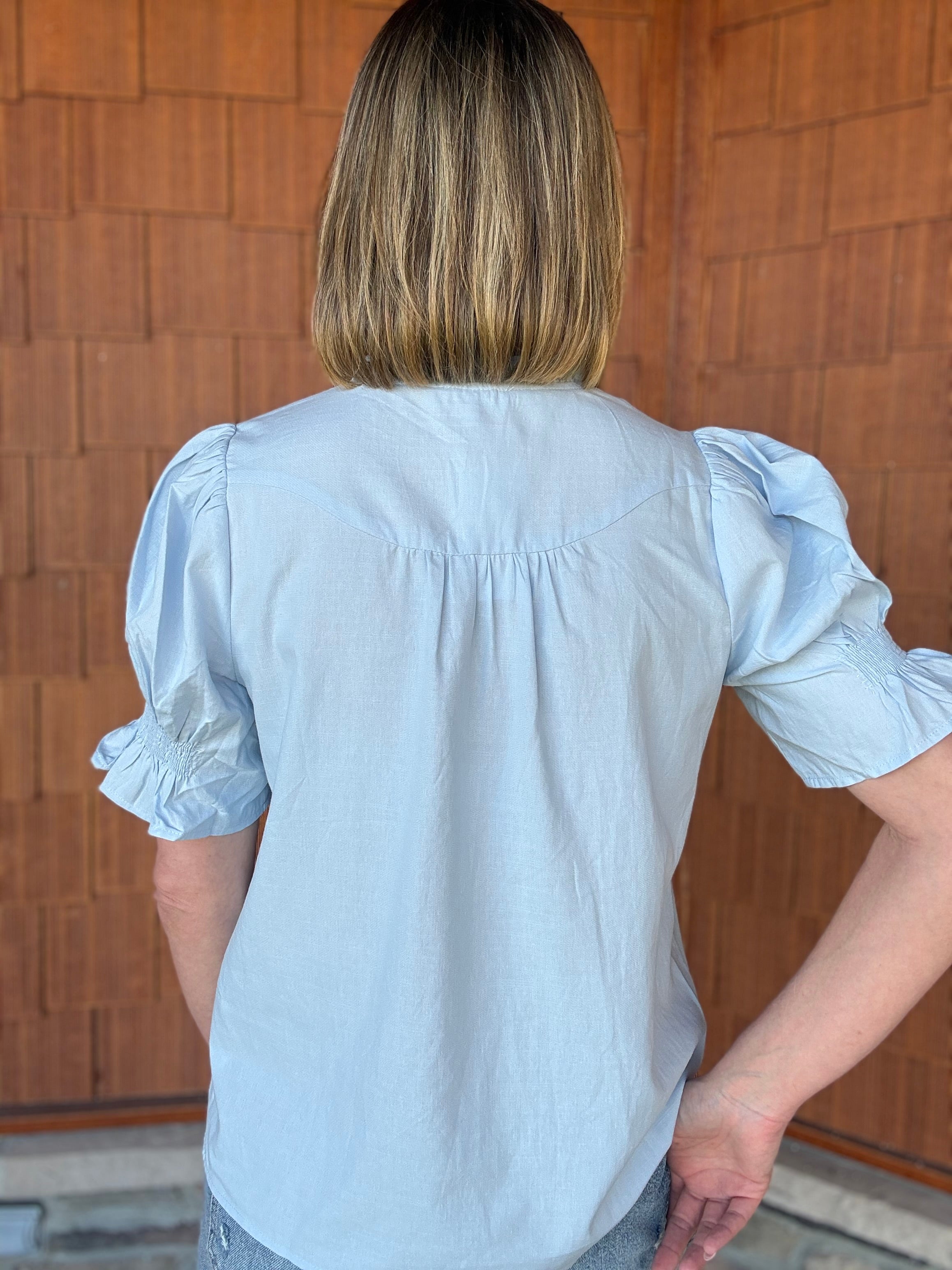 brooke & co soft skies top back view in light blue showing flowy silhouette and soft texture