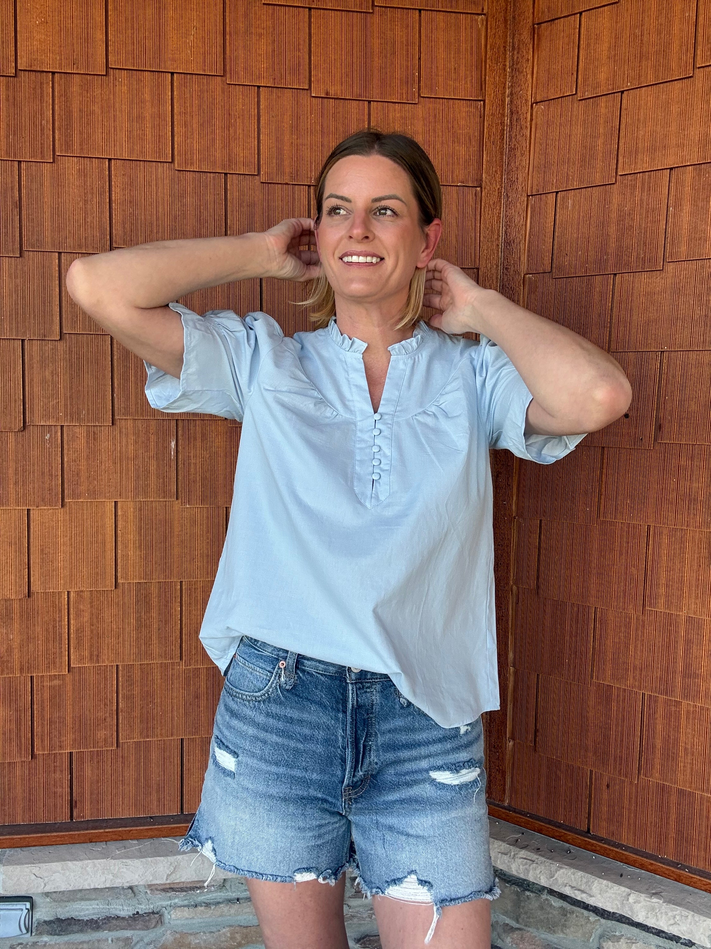 brooke & co soft skies top in light blue showing airy fit and soft lightweight fabric movement