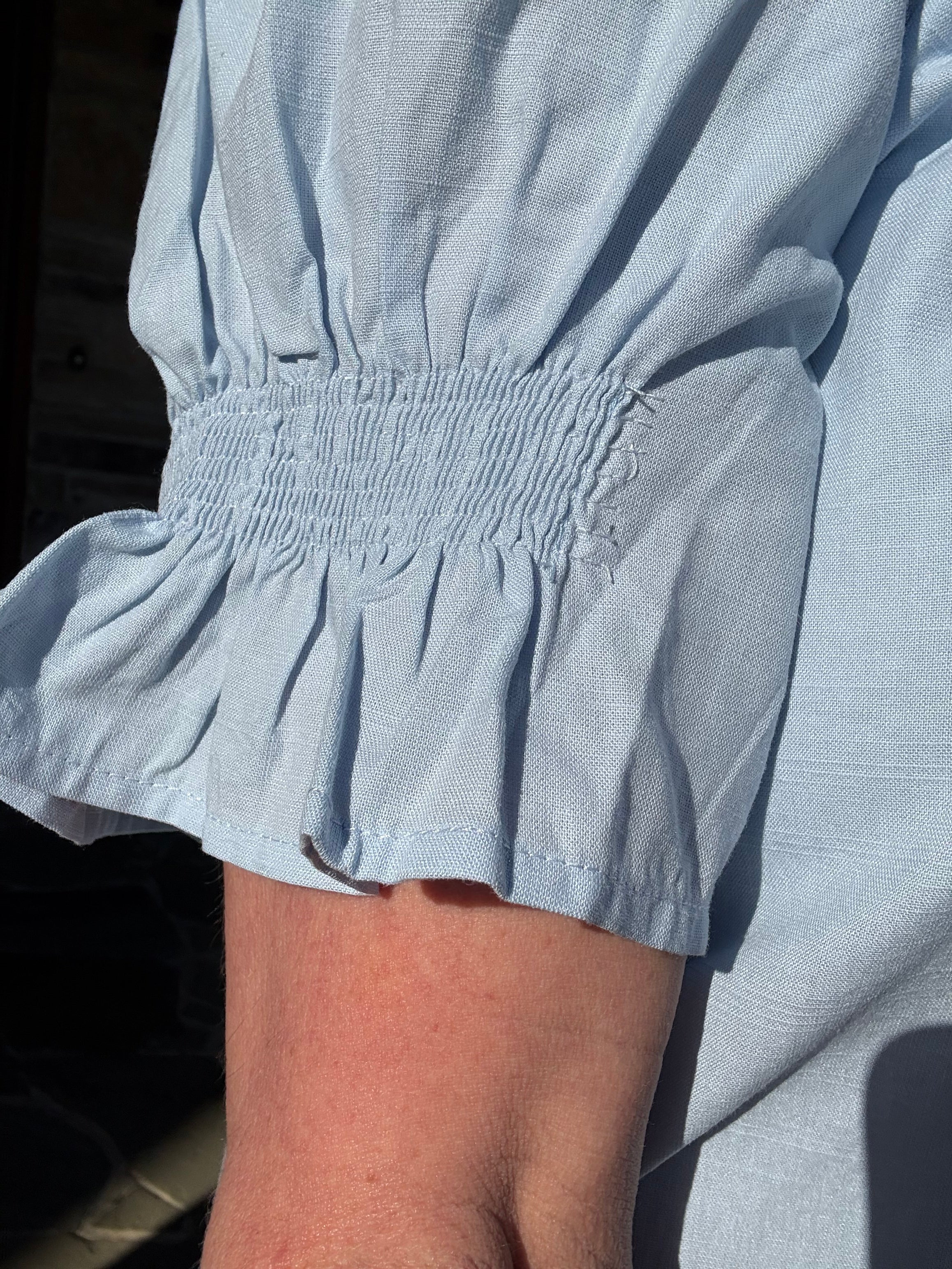 brooke & co light blue soft skies top sleeve detail showing smocked cuff and subtle texture