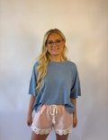 Brooke & Co blush lace athletic shorts in blush pink with lace trim and drawstring waist front view