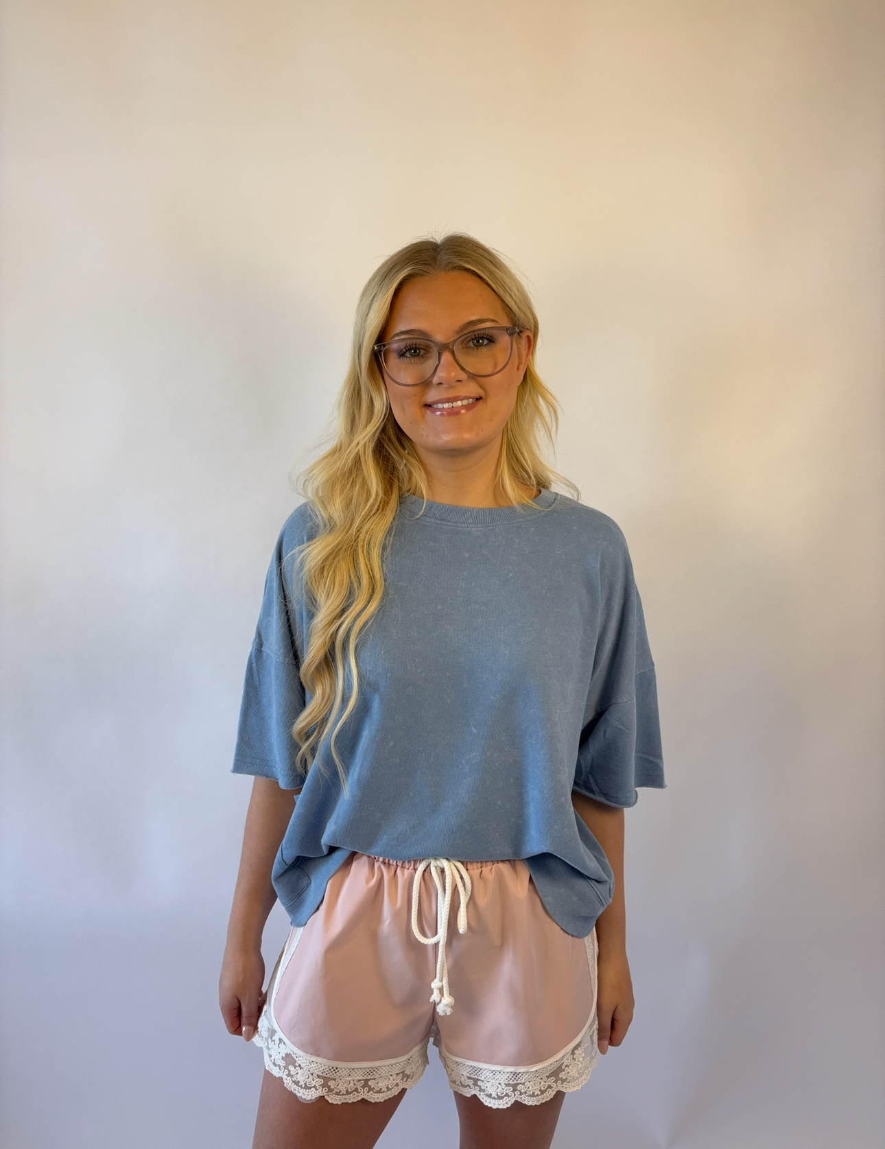 Brooke & Co blush lace athletic shorts in blush pink with lace trim and drawstring waist front view