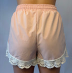 Brooke & Co blush lace athletic shorts in blush pink with lace trim and drawstring waist back view