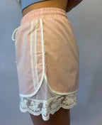 Brooke & Co blush lace athletic shorts in blush pink with lace trim and drawstring waist side detail view