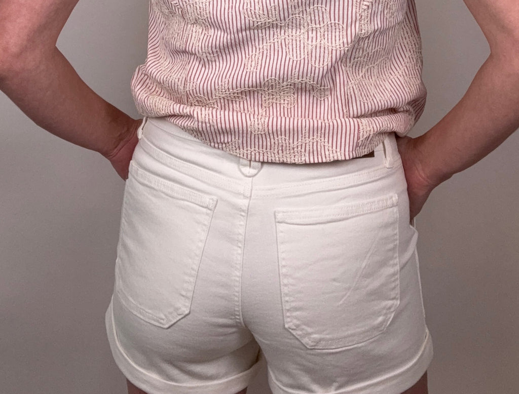 Brooke & Co bright tide denim shorts in white denim with cuffed hem and high rise fit detail back view