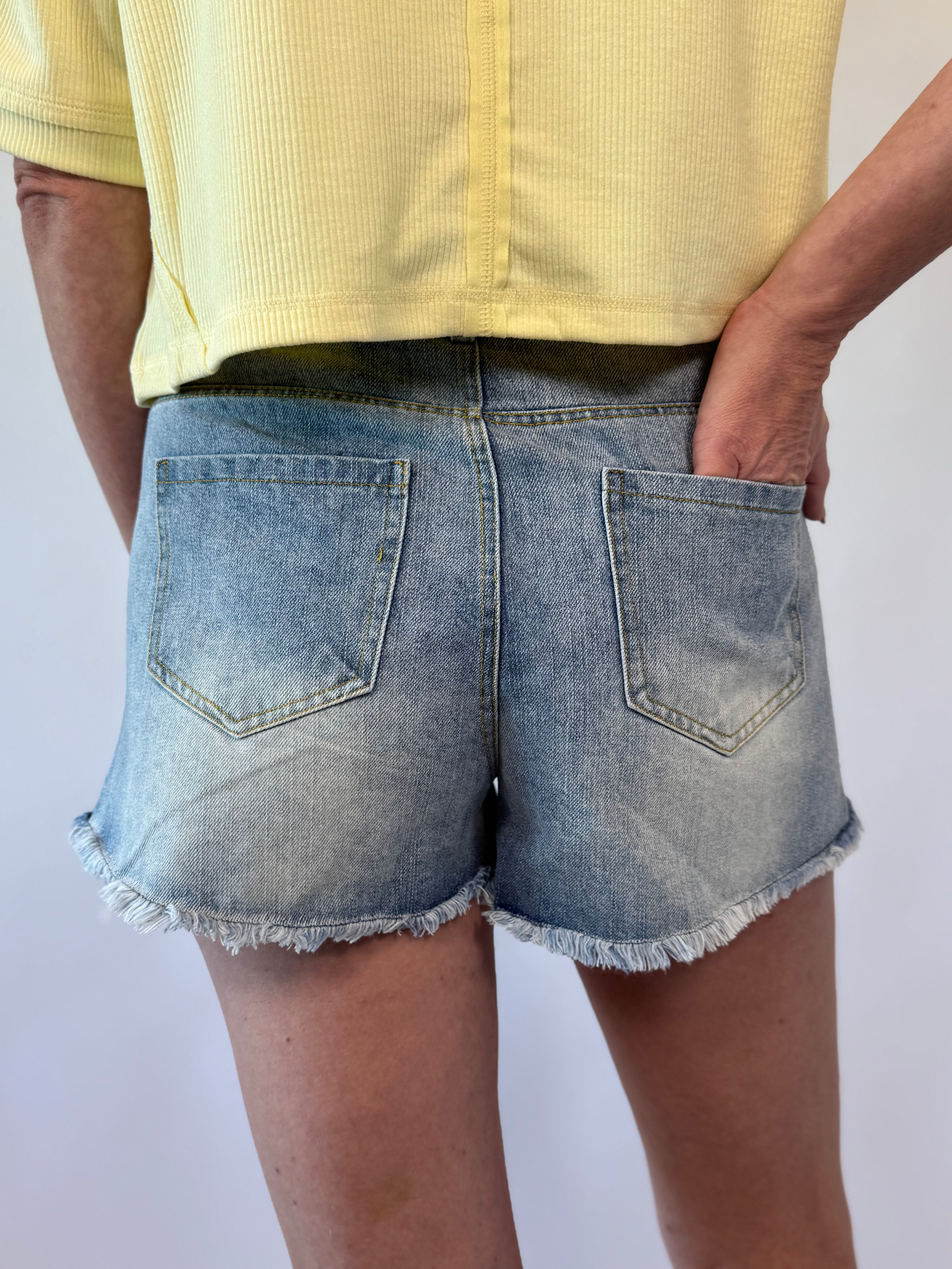 Brooke & Co Go-To Denim Shorts light wash raw hem boutique shorts back view