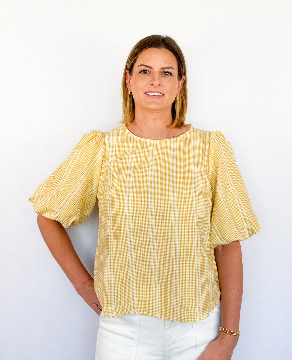 Brooke & Co Golden hour bow top textured detailing featuring statement puff sleeves and a relaxed silhouette front view