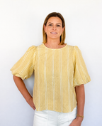 Brooke & Co Golden hour bow top textured detailing featuring statement puff sleeves and a relaxed silhouette front view