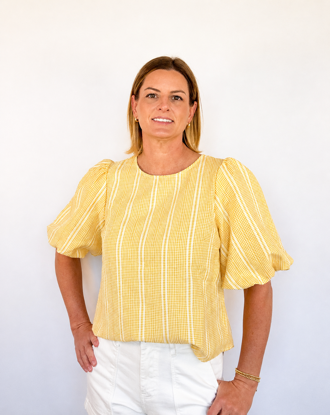 Brooke & Co Golden hour bow top textured detailing featuring statement puff sleeves and a relaxed fit