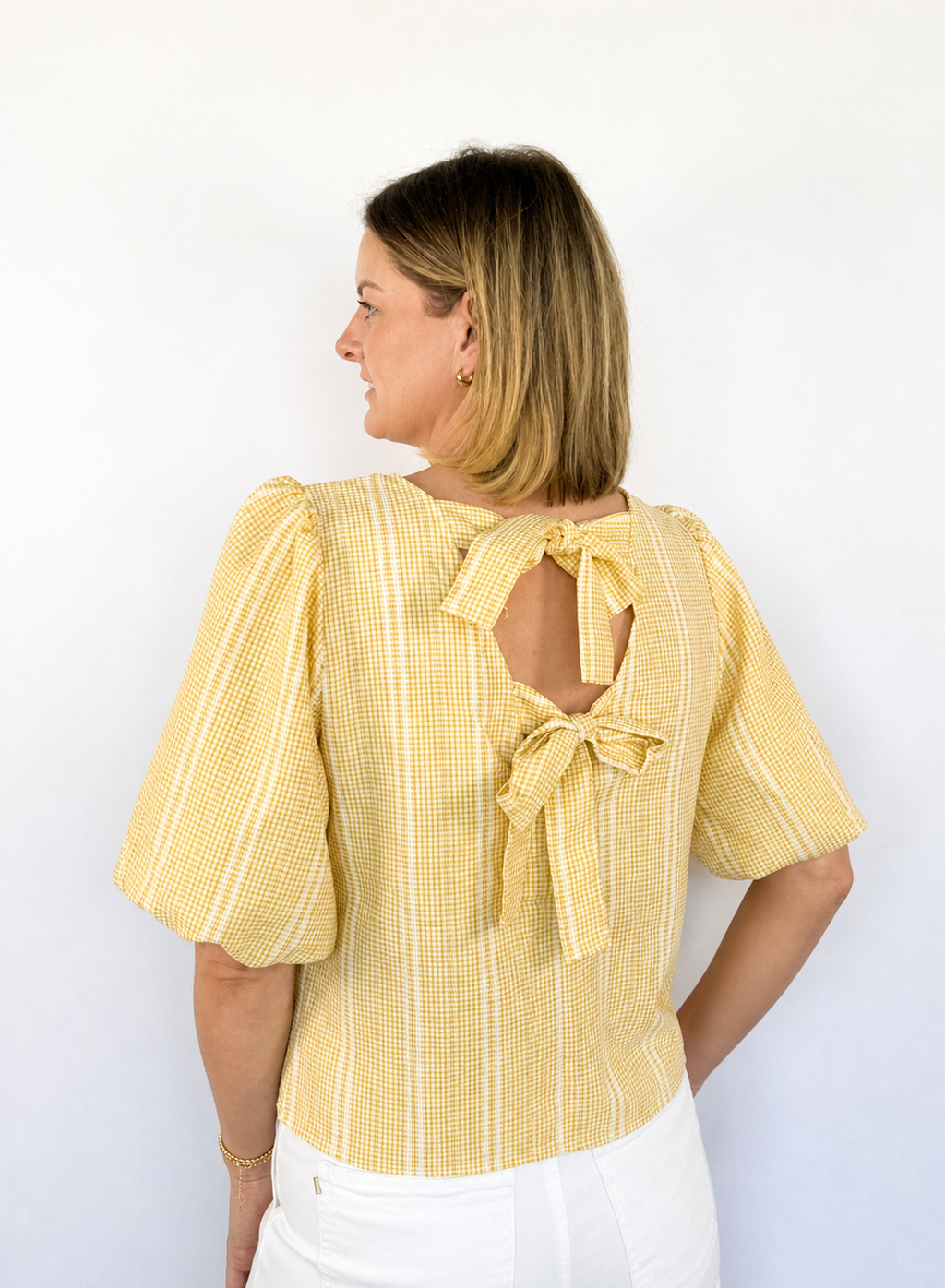 Brooke & Co Golden hour bow top textured detailing featuring statement puff sleeves and a relaxed silhouette back view