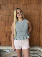 brooke & co blue haven top blue smocked sleeveless top with peplum hem and fitted bodice bow ties on the side