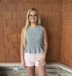 brooke & co blue haven top blue smocked sleeveless top with peplum hem and fitted bodice bow ties on the side front view