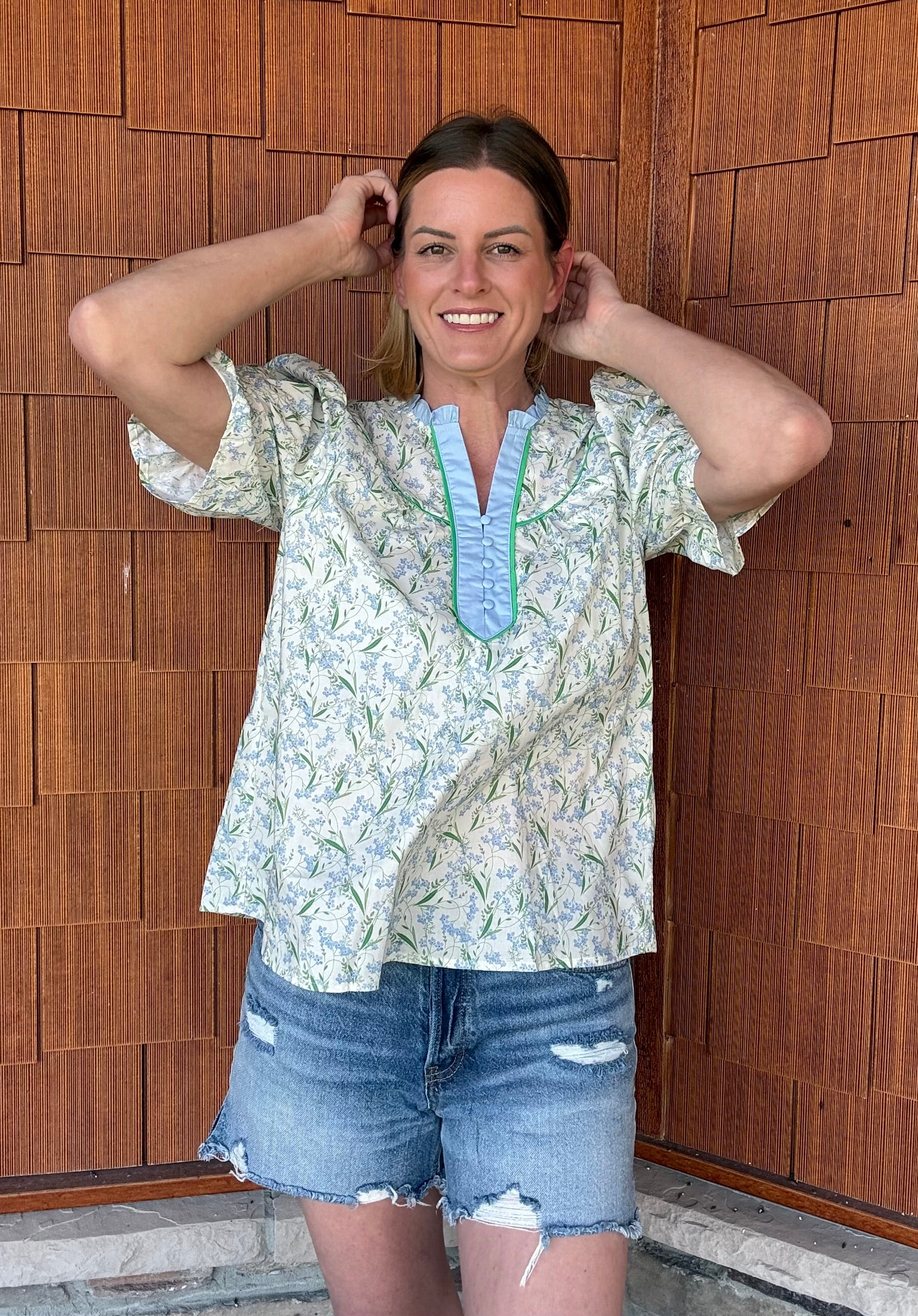 Brooke & Co spring meadow top showing smocked sleeve cuffs and relaxed fit in blue and green floral print