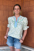 Brooke & Co spring meadow top in blue and green floral styled with denim shorts, everyday outfit front view