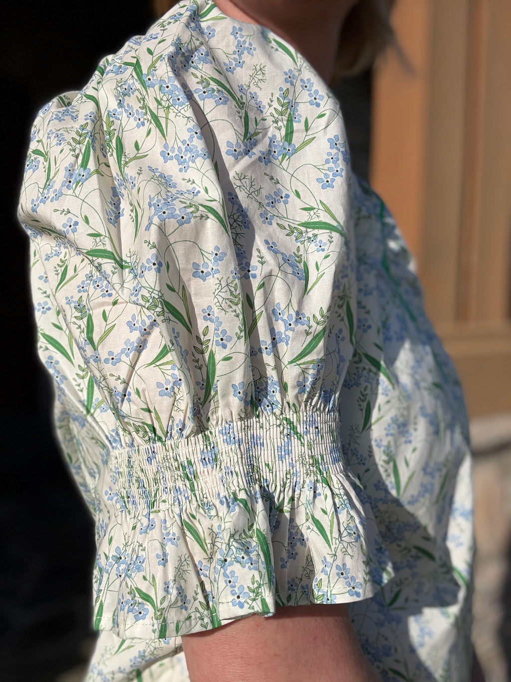 brooke & co spring meadow top blue and green floral fabric detail showing soft lightweight texture and cuff sleeve