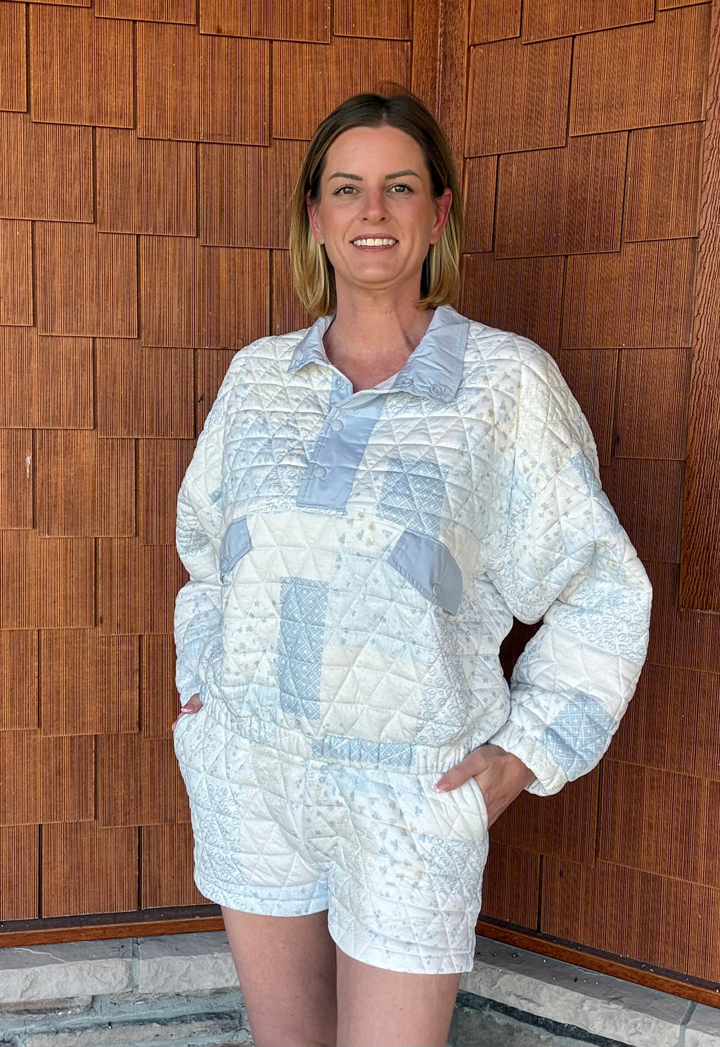 brooke & co blue cottage jacket in blue combo styled with matching shorts, quilted set front view