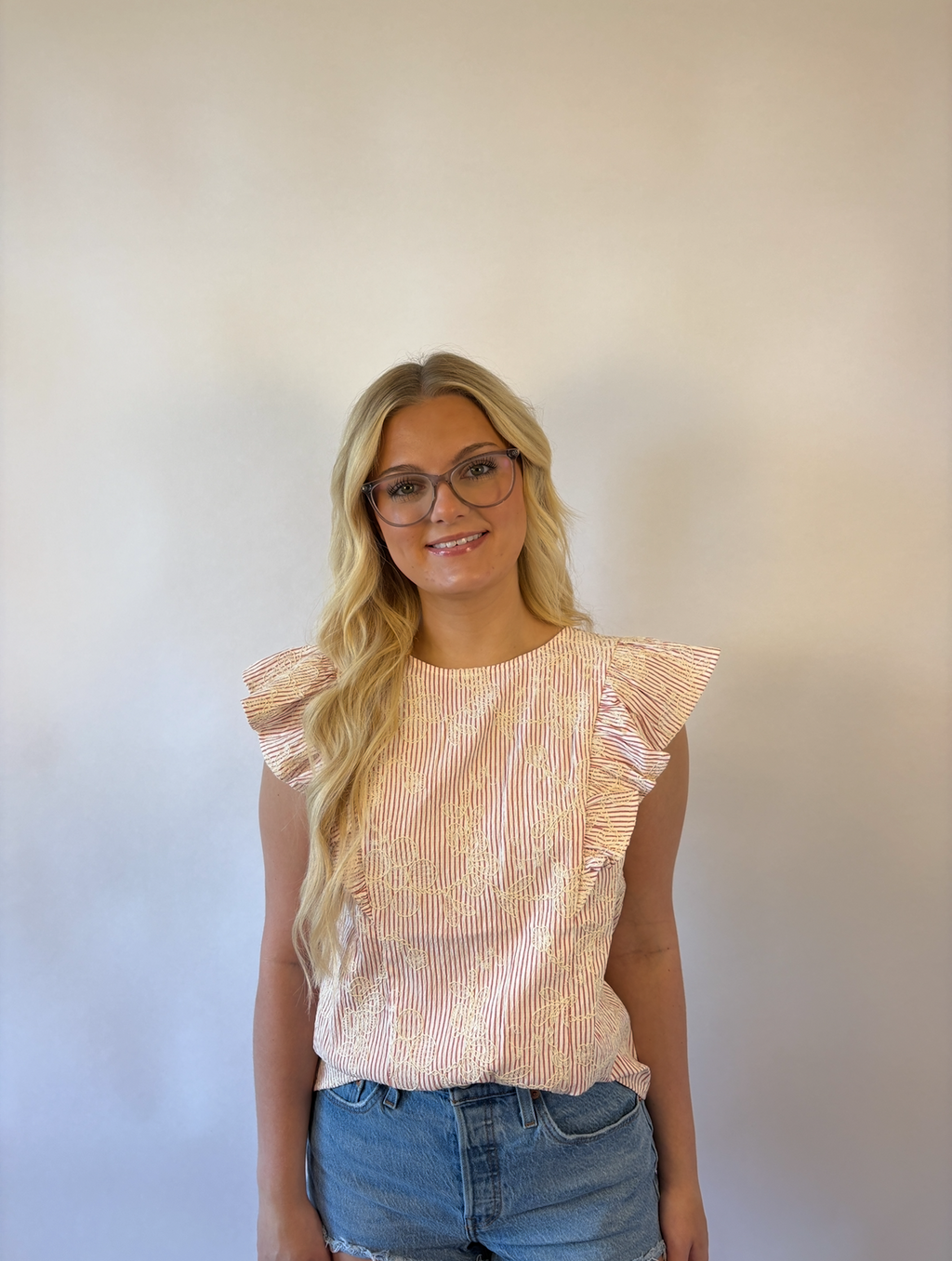 Brooke & Co petal striped blouse in red and ivory stripes with ruffle sleeves and flower applique close