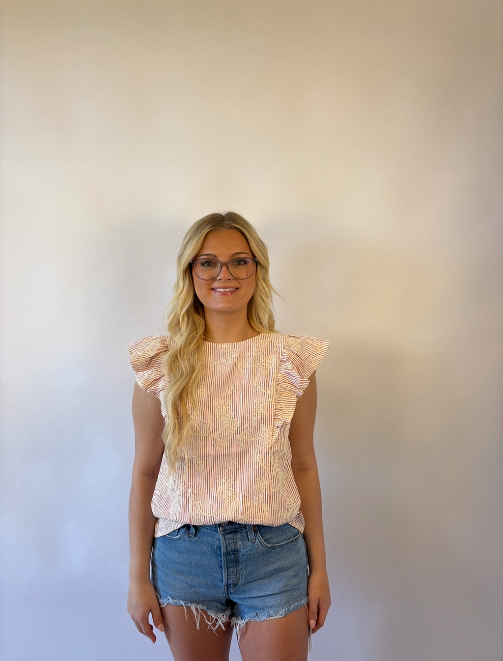 Brooke & Co petal striped blouse in red and ivory stripes with ruffle sleeves and flower applique front view