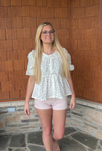 brooke & co polka dot darling white and black polka dot babydoll top with puff sleeves and tie neckline, flowy fit, front view