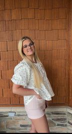 brooke & co polka dot darling white and black polka dot babydoll top with puff sleeves and tie neckline, flowy fit, side view