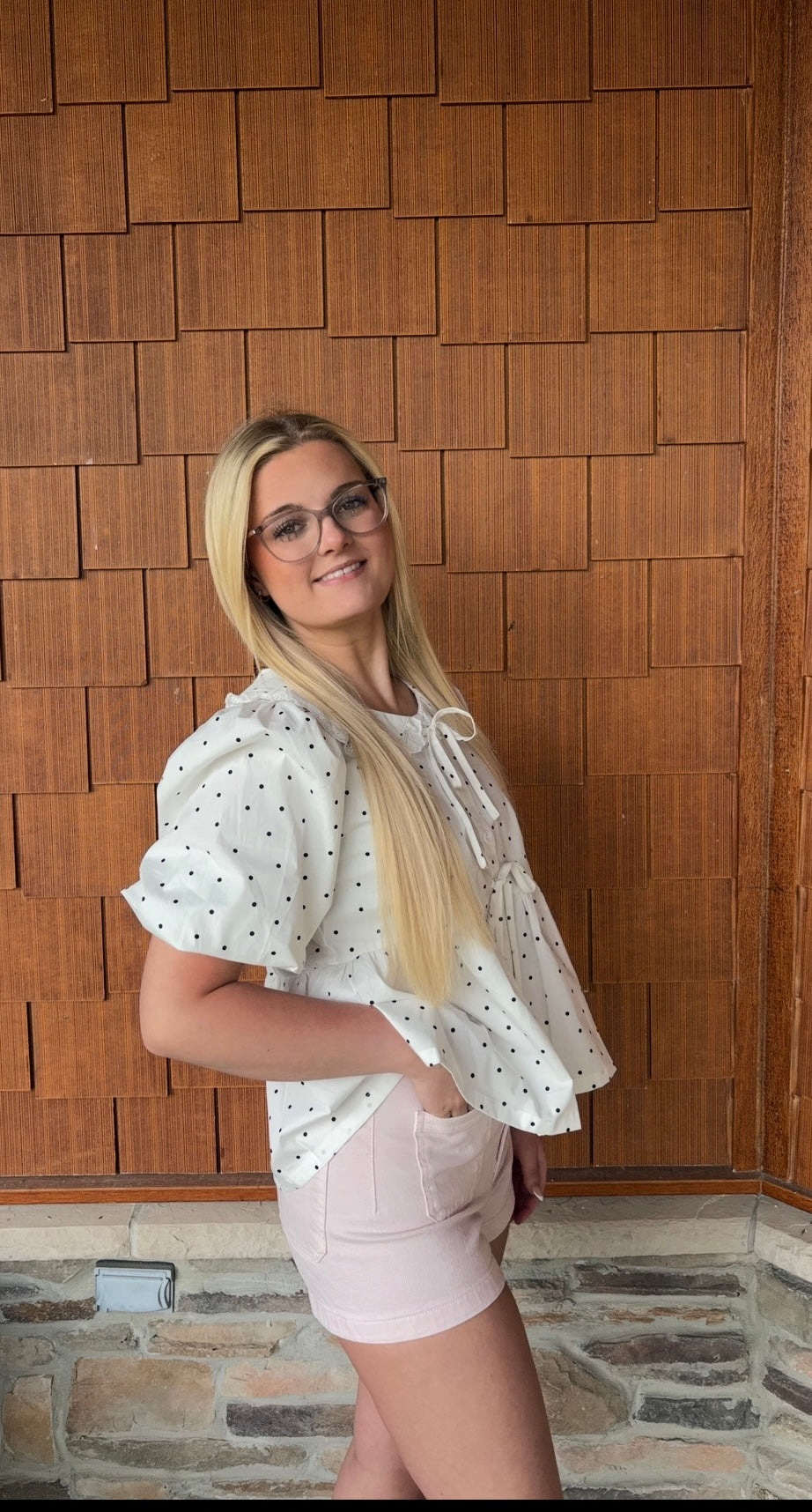 brooke & co polka dot darling white and black polka dot babydoll top with puff sleeves and tie neckline, flowy fit, side view