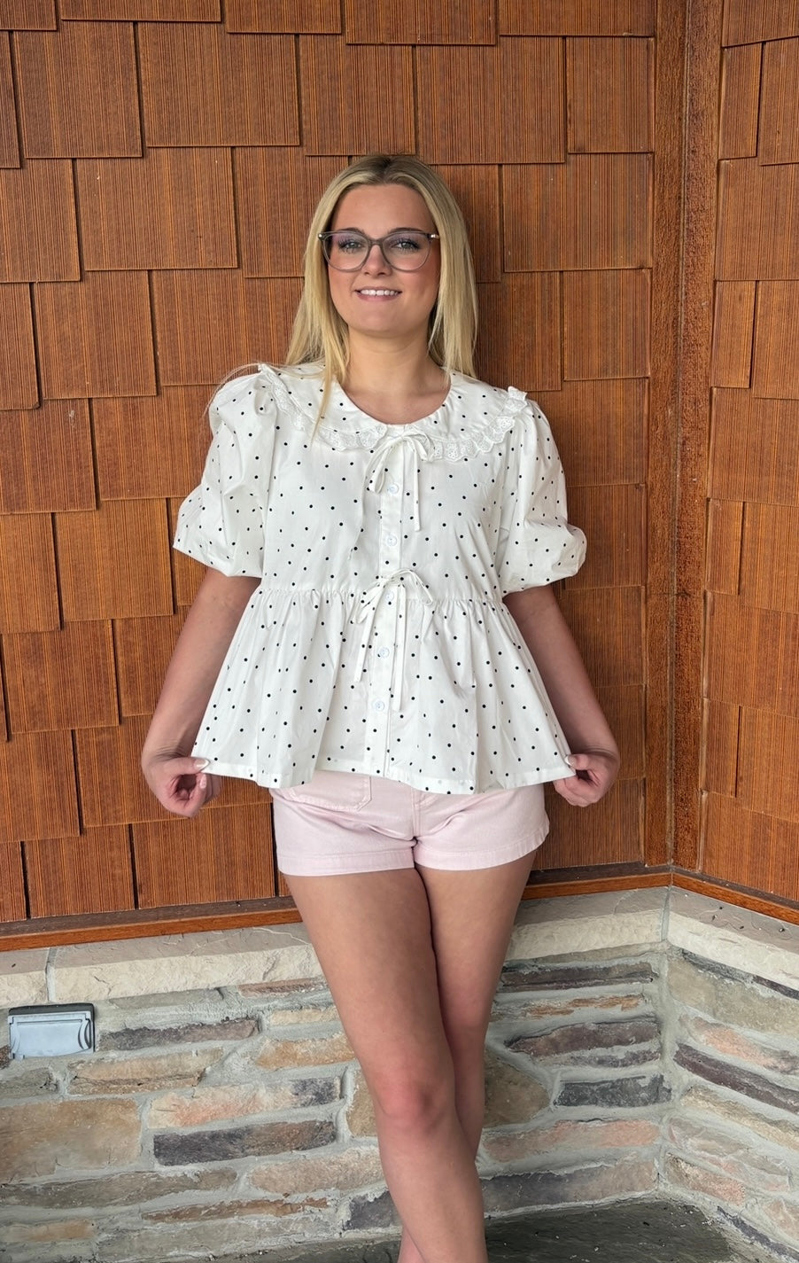 brooke & co polka dot darling white and black polka dot babydoll top with puff sleeves and tie neckline, flowy fit, close view