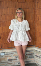 brooke & co polka dot darling white and black polka dot babydoll top with puff sleeves and tie neckline, flowy fit, close view