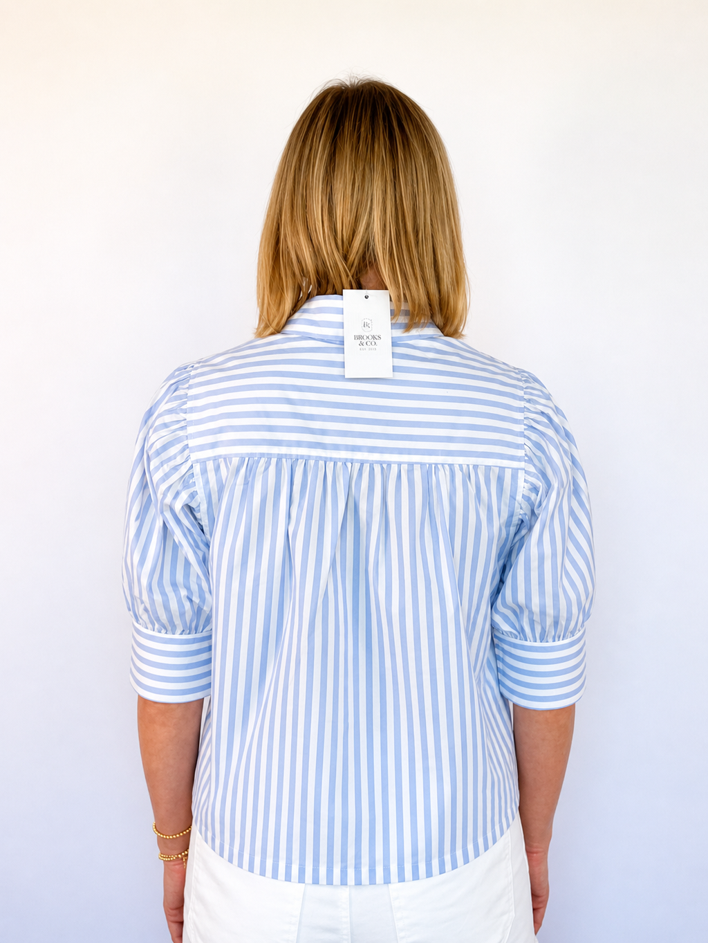 Brooke & co sailor striped top blue and white striped blouse with voluminous puff sleeves collared neckline and a tailored button front back view
