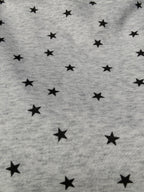 brooke & co grey and black star print fabric detail of under the stars top showing soft knit texture