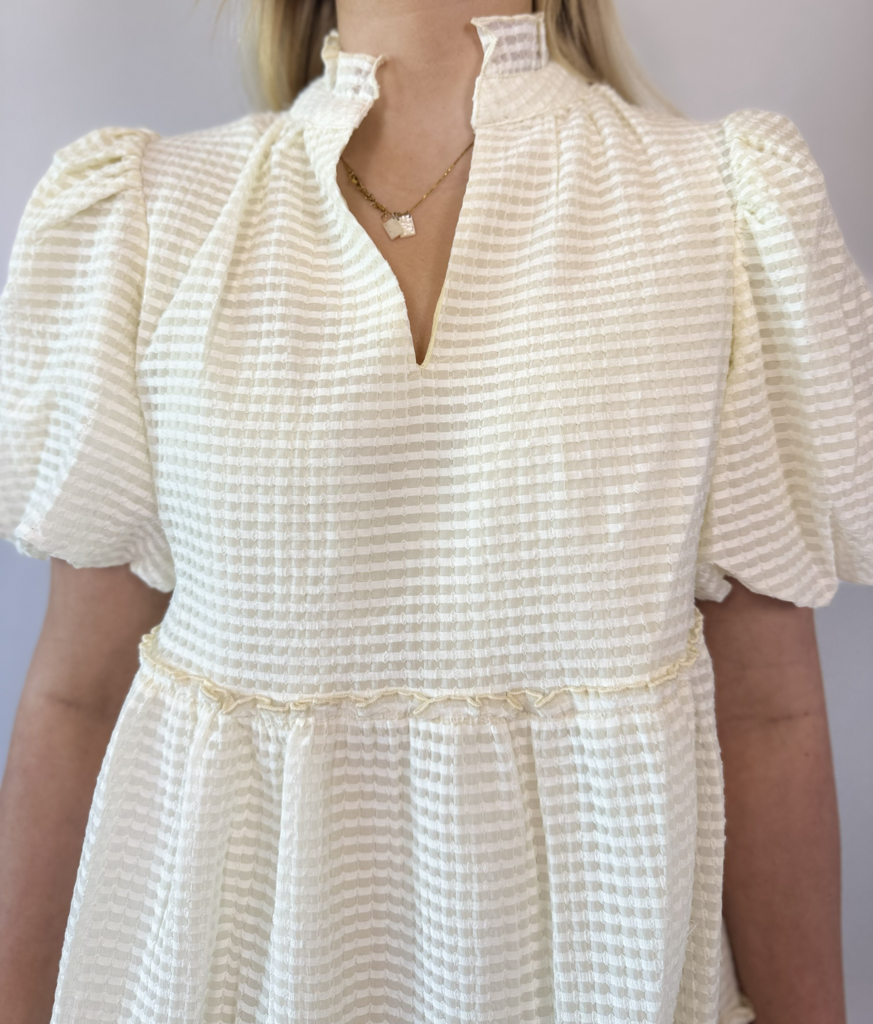 Brooke & Co The Sunday Dress cream textured dress short sleeve babydoll dress front close up view