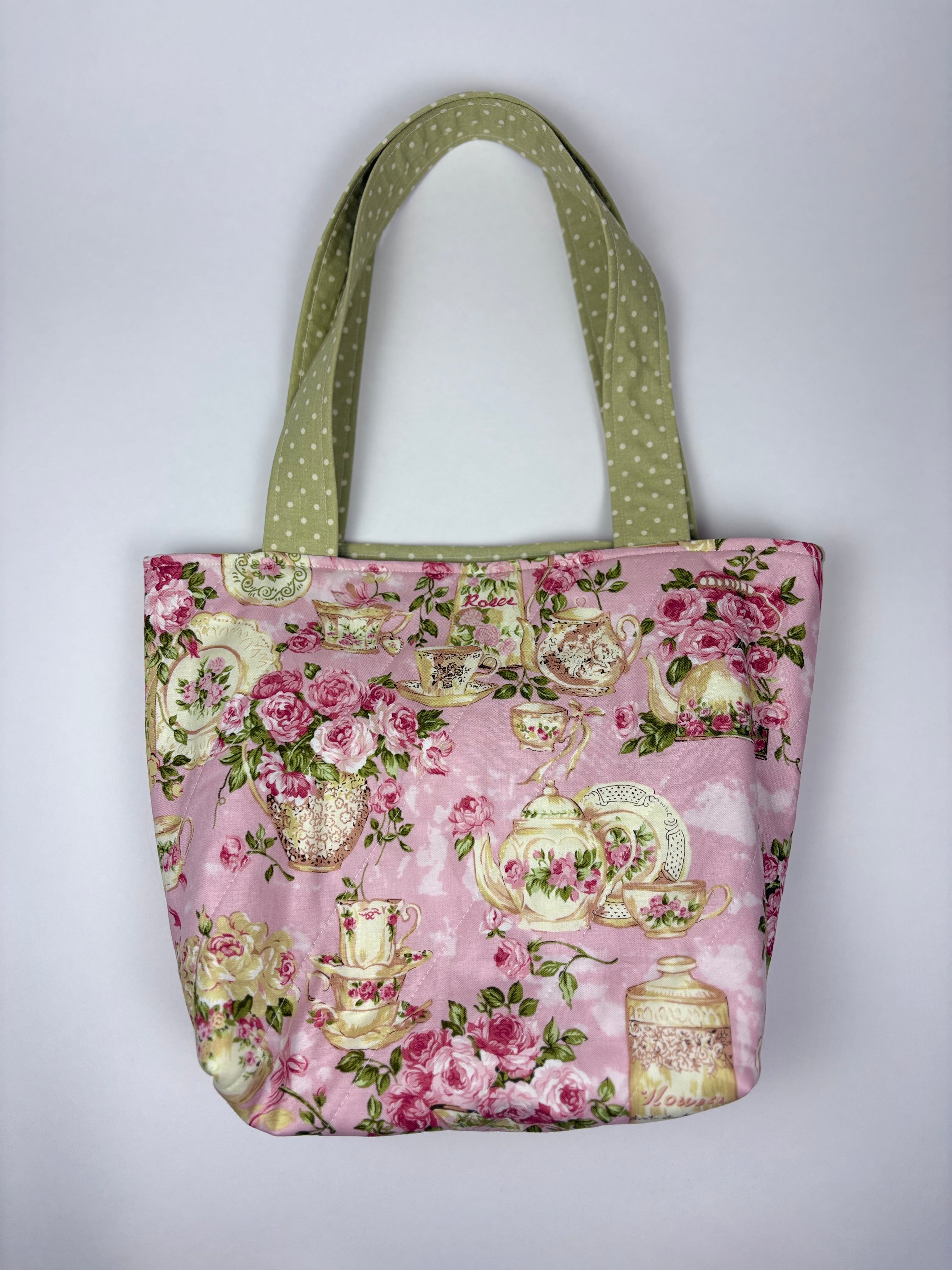 Brooke & Co handmade pink vintage teapot print boutique tote bag with green polka dot straps, floral cottagecore fabric purse front detail view