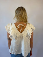 Brooke & Co white willow top in white with ruffle sleeves, v-neck, bow tie in back back view